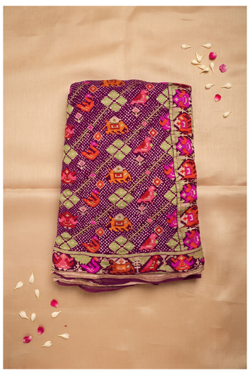Exquisite Deep Purple Patola Silk Saree With Heritage Elephant And Bird Motifs