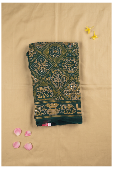 Elegant Dark Green Saree With Gold Embroidery And Traditional Elephant Motifs