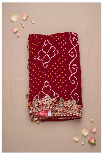 Shavona Elegant Maroon Georgette Bandhani Saree With Embroidered Peacock Border