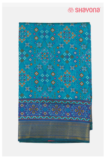 Glossy Teal Printed Patola Cotton Saree