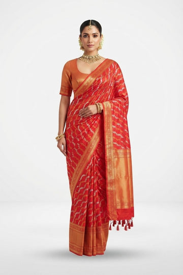 Elegant Red Silk Saree With Ornate Golden Zari Border And Tasseled Pallu