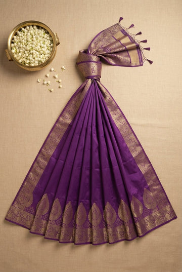 Elegant Purple Silk Saree With Ornate Golden Zari Border