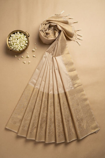 Elegant Champagne Gold Self-Weave Banarasi Silk Saree With Tassel Details