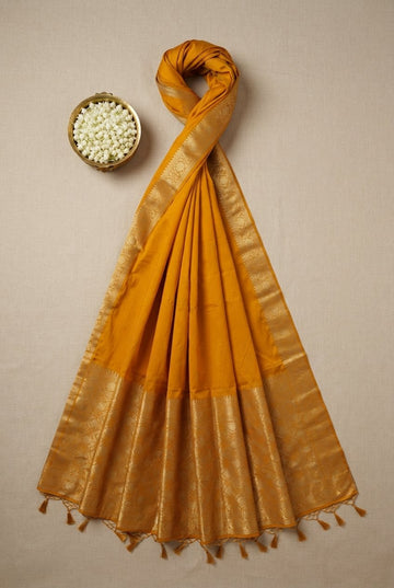 Exquisite Mustard Yellow Silk Saree With Ornate Golden Zari Border And Tassels
