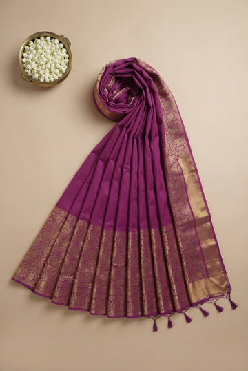 Elegant Deep Magenta Silk Saree With Rich Golden Zari Border And Tassels