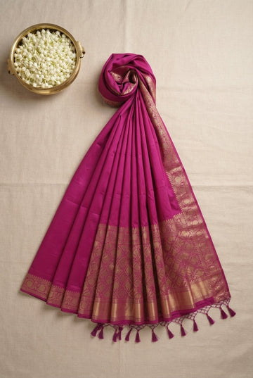 Elegant Magenta Banarasi Silk Blend Saree With Rich Golden Zari Border And Tassels
