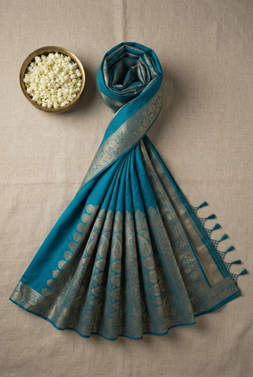 Elegant Teal Blue Silk Blend Saree With Rich Golden Zari Woven Border And Paisley Motifs
