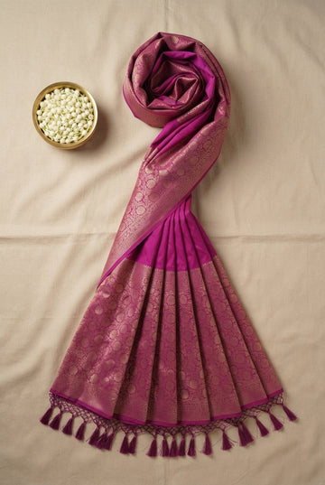 Elegant Magenta Pink Banarasi Silk Saree With Rich Gold Zari Border And Hand-Tied Tassels