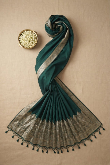 Elegant Emerald Green Silk Saree With Traditional Silver Zari Border And Tassels