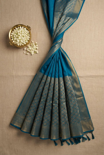 Elegant Teal Blue Silk Saree With Intricate Gold Zari Border And Pleat Patterns