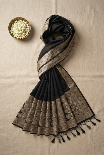 Elegant Jet Black Banarasi Silk Saree With Antique Gold Zari Border And Tassels