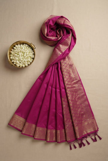 Elegant Magenta Silk Blend Saree With Rich Golden Zari Border And Tassels