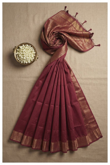 Elegant Deep Maroon Silk Cotton Saree With Traditional Gold Zari Border And Tassels