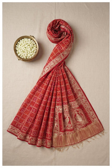 Traditional Red Bandhani Saree With Exquisite Gold Zari Borders And Pallu