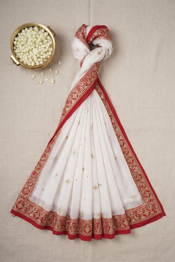 Elegant Off-White Saree With Ornate Red And Gold Zari Border