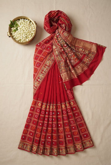Heritage Crimson Red Bandhani Silk Saree With Intricate Zari Border And Folk Motif Pallu