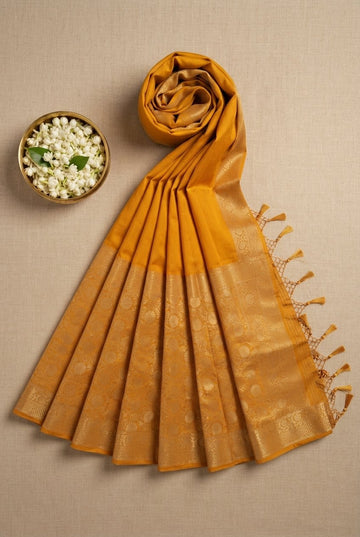 Elegant Mustard Yellow Silk Saree With Rich Golden Zari Border And Tassels