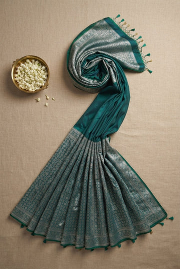 Teal Green Banarasi Soft Silk Saree With Intricate Silver Zari Work