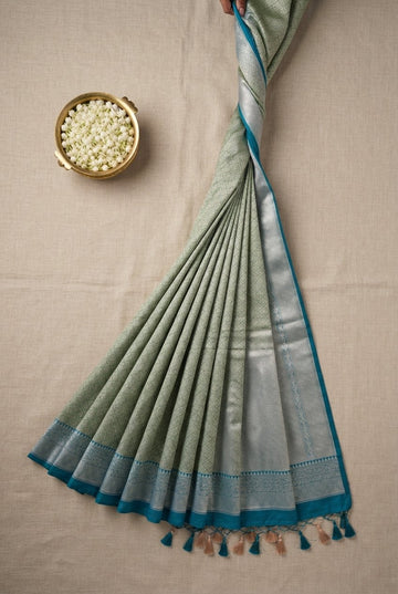 Elegant Sage Green Banarasi Silk Blend Saree With Teal And Silver Zari Border