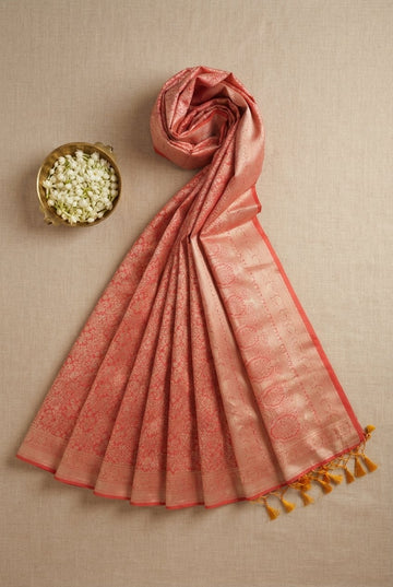 Elegant Coral Peach Banarasi Silk Saree With Intricate Gold Zari Brocade