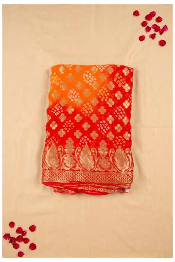 Vibrant Orange And Red Ombre Bandhani Print Georgette Saree With Gold Zari Border